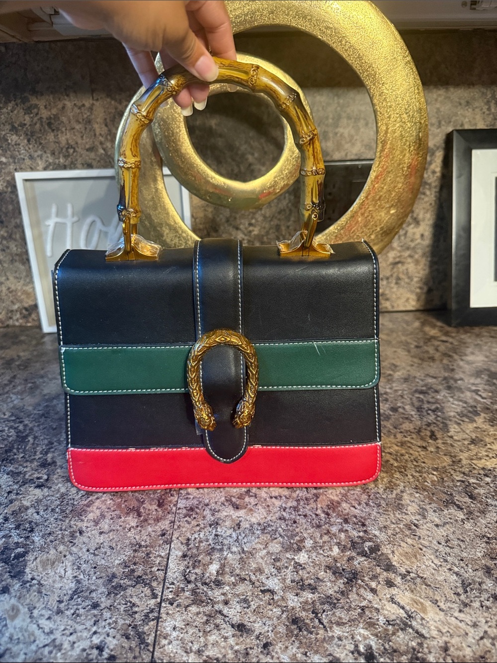 Ladies Black Leather bamboo Top-Handle Bag with Red & Green Accents.